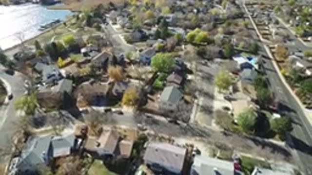 HIDDEN LAKE COLORADO-2016: Camera Panning Over Neighborhood With Green Trees And