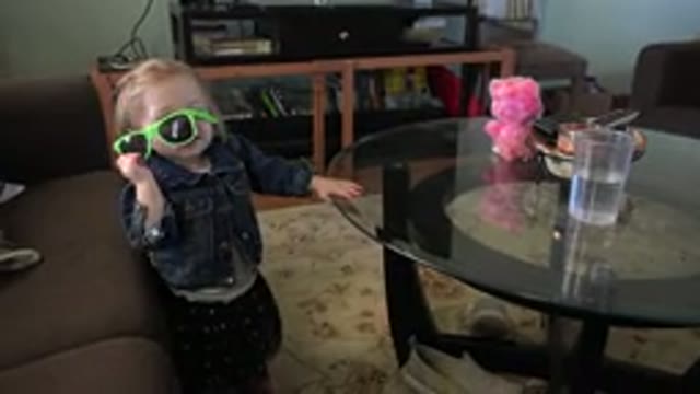WESTMINSTER COLORADO-2016: Cute Little Girl Playing With Green Sunglasses