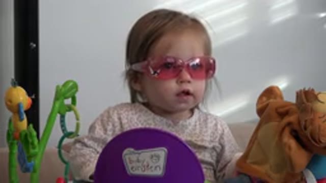 WESTMINSTER COLORADO-2016: A Little Girl Wearing Safety Glasses in Her Playpen
