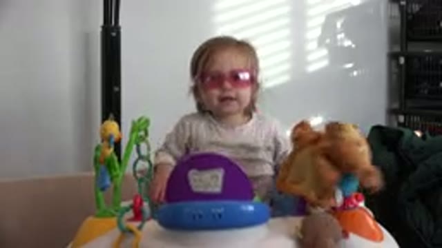 WESTMINSTER COLORADO-2016: Child Jumping On A Stroller Wearing Pink Glasses