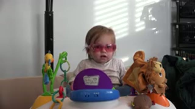 WESTMINSTER COLORADO-2016: Toddler With Pink Sunglasses Playing With Toys Indoors