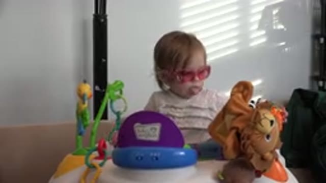 WESTMINSTER COLORADO-2016: A Child Sitting With Several Toys Around Him And A