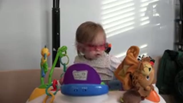 WESTMINSTER COLORADO-2016: Child In Sunglasses Sits At A Table Plays With Toys