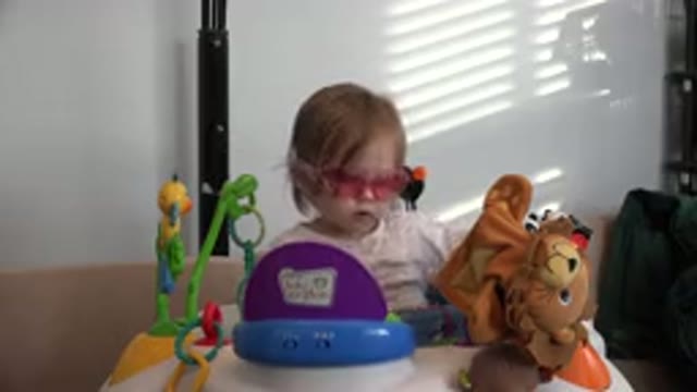 WESTMINSTER COLORADO-2016: Cute Little Girl With Sunglasses Playing In Exerciser