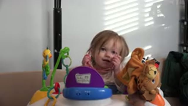 WESTMINSTER COLORADO-2016: Baby Girl Blond Sitting Smile Playing Pink Glasses
