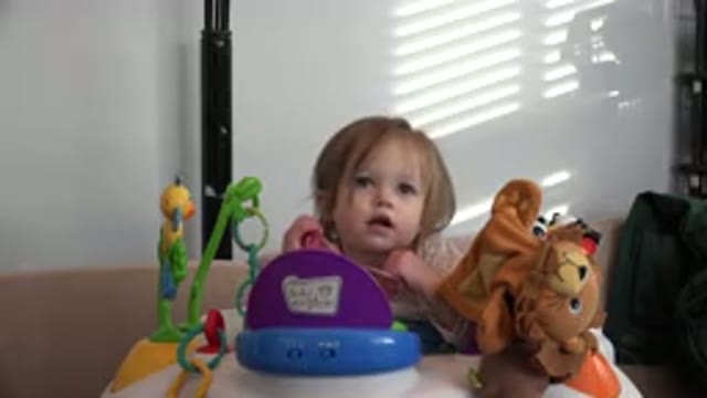 WESTMINSTER COLORADO-2016: Child Sitting At A Table In Front Of Him With Several Toys