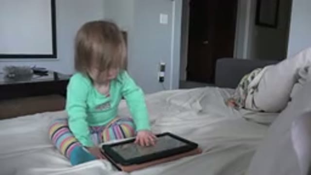 WESTMINSTER COLORADO-2016: Toddler Girl in Rainbow Tights and Blue Shirt Sitting