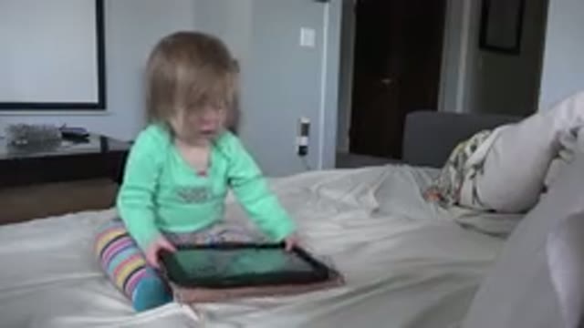 WESTMINSTER COLORADO-2016: A Little Girl Is Sitting On The Bed And Carrying A