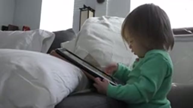 WESTMINSTER COLORADO-2016: Baby Playing With A Tablet Computer