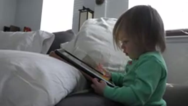 WESTMINSTER COLORADO-2016: A Very Young Child Surrounded By Pillows Playing With Tablet