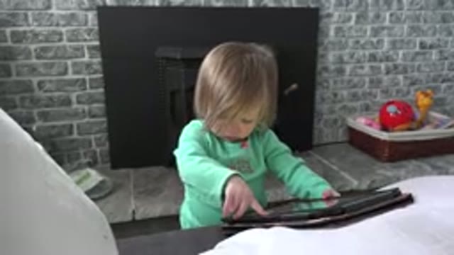 WESTMINSTER COLORADO-2016: A Young Child Trying To Figure Out How To Operate An iPad