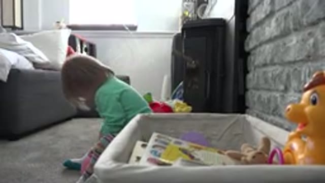 WESTMINSTER COLORADO-2016: A Child Playing With Toys In A Room On The Floor