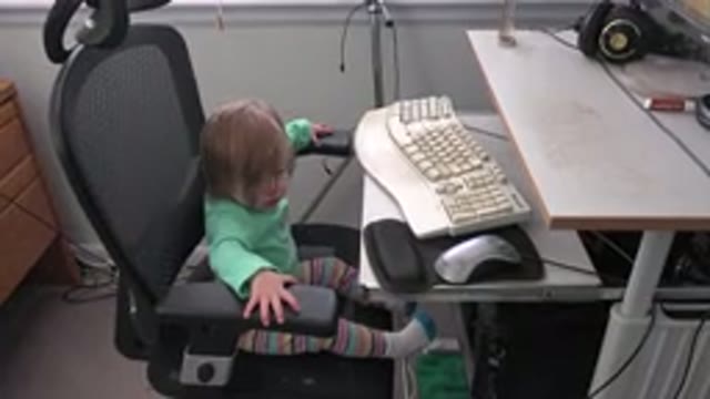 WESTMINSTER COLORADO-2016: Curious Baby Girl Sitting On A Computer Chair