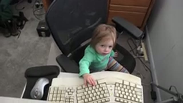 WESTMINSTER COLORADO-2016: Child Sitting In Front Of Computer Plays With