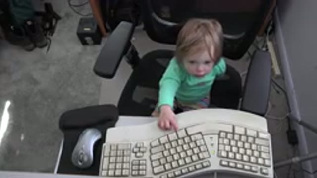 WESTMINSTER COLORADO-2016: Little Girl Sitting at Computer in Home Setting