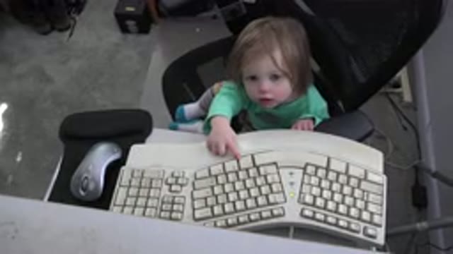WESTMINSTER COLORADO-2016: Small Kid Sitting On An Office Chair And Trying To Type
