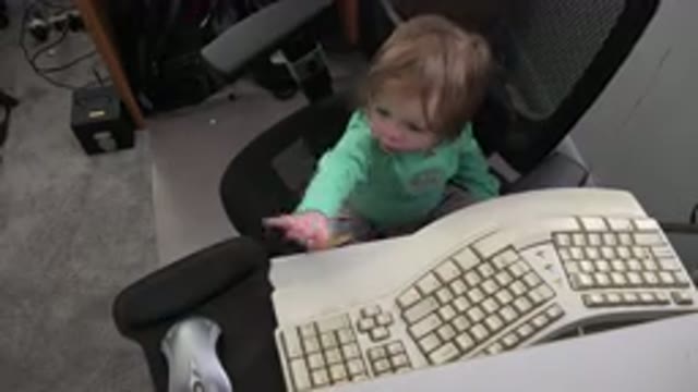 WESTMINSTER COLORADO-2016: Toddler Reaching For A Computer's Mouse While Sitting