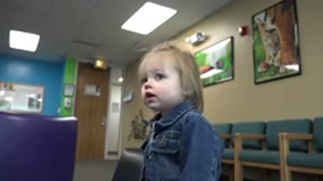 DENVER COLORADO-2016: Child Distracted in Denim Jacket in Empty Waiting Room