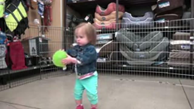 DENVER COLORADO-2016: Baby Playing With A Balloon In Fenced Kids Play Area
