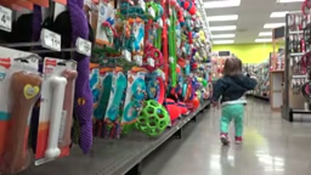 DENVER COLORADO-2016: Small Kid Walking In An Empty Isle Filled With Toys In A