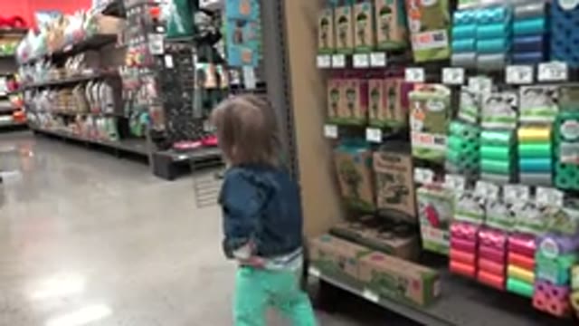 DENVER COLORADO-2016: Baby Walking In A Supermarket Alley With No Customers And