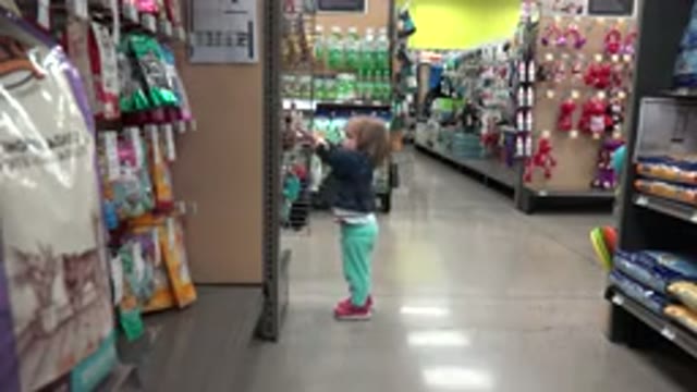 DENVER COLORADO-2016: Young Child Reaching For A Product In A Store