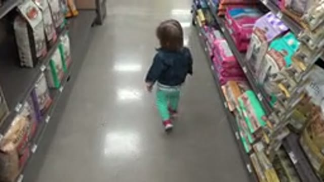DENVER COLORADO-2016: Parent Filming His Child Walking In A Store Aisle Full Of Products