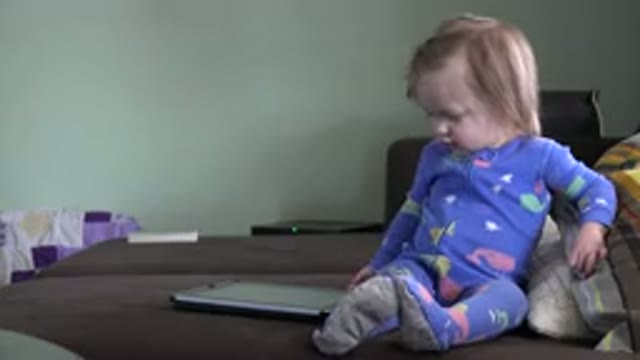 WESTMINSTER COLORADO-2016: One Kid Playing With A Tab Beside Her