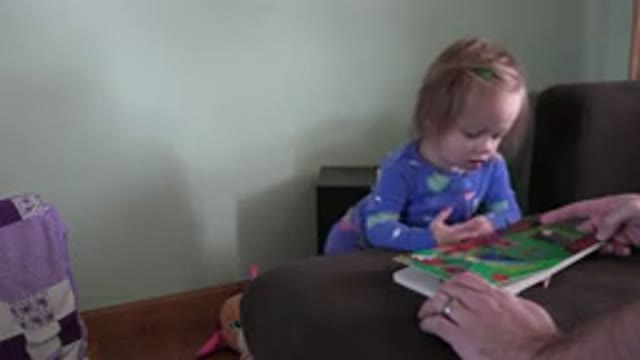 WESTMINSTER COLORADO-2016: Cute Blonde Baby In Purple Oneness Laughing And Reading