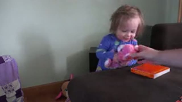 WESTMINSTER COLORADO-2016: Small Baby Sits In Highchair And Plays With Colorful Stuffed Animals