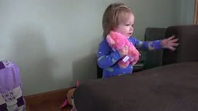 WESTMINSTER COLORADO-2016: A Little Girl Playing With Her Plush Toy On The Couch
