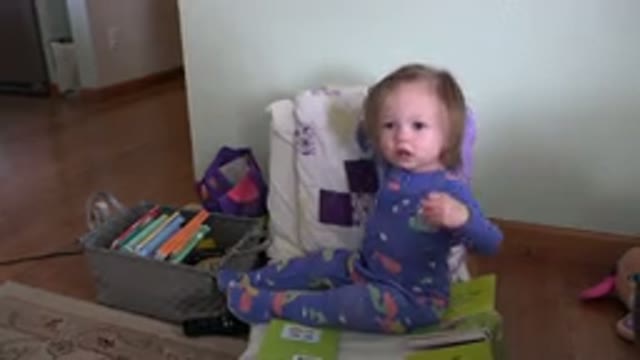 WESTMINSTER COLORADO-2016: Child Sitting Playing With Books