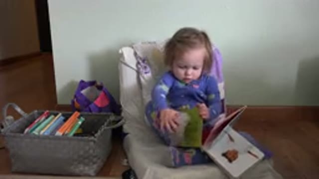 WESTMINSTER COLORADO-2016: A Baby Is Playing In Her Room With Books