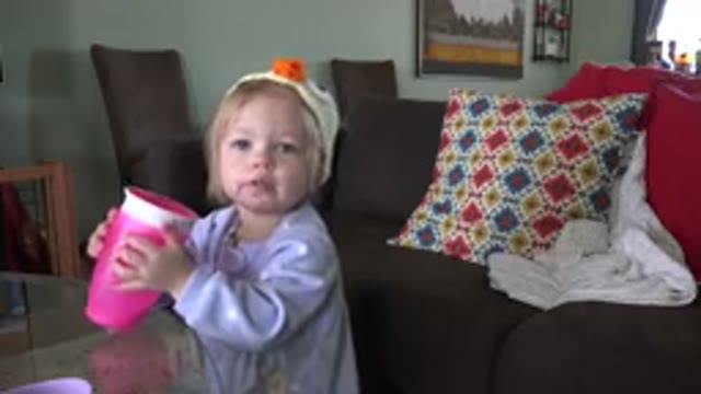 WESTMINSTER COLORADO-2016: Little Cute Girl Drinks Water From Her Pink Container