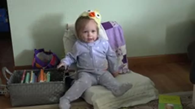 WESTMINSTER COLORADO-2016: A Cute Little Girl Sitting On A Rocking Chair With