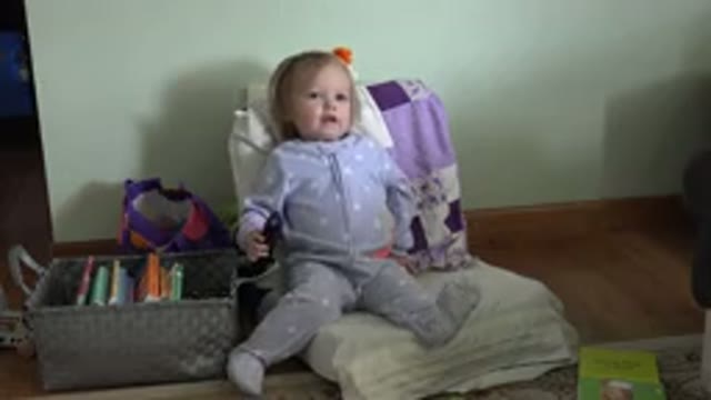 WESTMINSTER COLORADO-2016: Baby Girl Sitting With Control In Hand Basket With Books