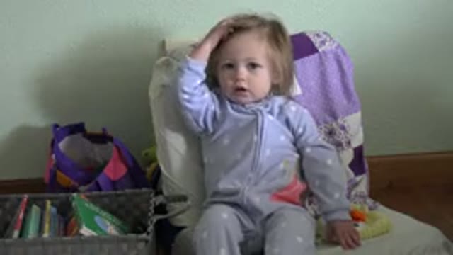 WESTMINSTER COLORADO-2016: Toddler Girl Sitting In A Child's Chair Scratching Head