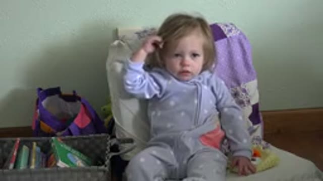 WESTMINSTER COLORADO-2016: Little Girl In A High Chair Playing With Her Hair