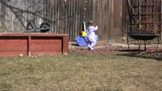 WESTMINSTER COLORADO-2016: Toddler Playing in Backyard Near Outdoor Furniture