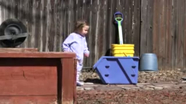 WESTMINSTER COLORADO-2016: A Child Walks Outside Past an Outdoor Toy