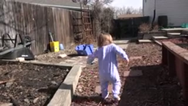 WESTMINSTER COLORADO-2016: Little Kid Dressed in Pajamas Walking Barefoot in Backyard