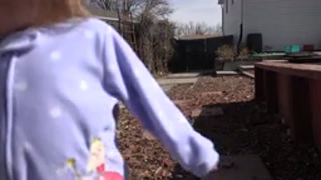 WESTMINSTER COLORADO-2016: Child Blocking The View Of A Garden At Someone's