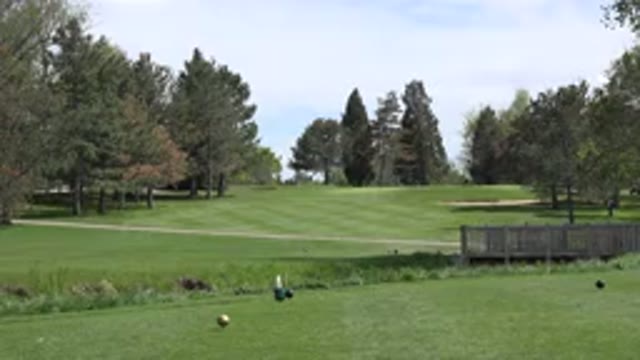 DENVER COLORADO-2015: Breezy Outdoors Golf Course Lawn Stream Bridge Sky Clouds