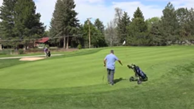 DENVER COLORADO-2015: Two Men Playing Golf At A Golf Course