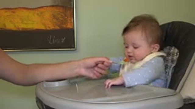 WESTMINSTER COLORADO-2015: Baby Agitating Arms While Adult's Arm Supports