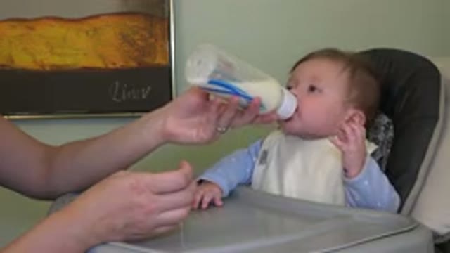 WESTMINSTER COLORADO-2015: Cute Baby Girl Drinking Milk on Her Bottle