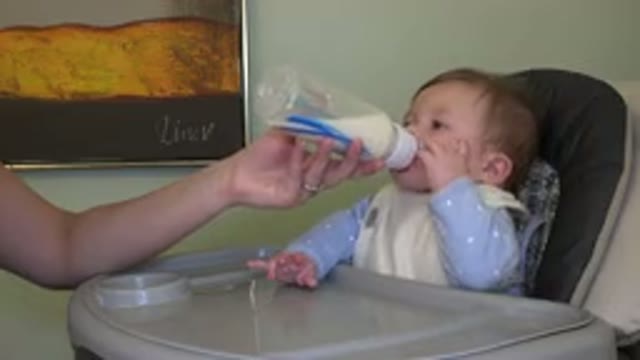 WESTMINSTER COLORADO-2015: Baby Taking His Bottle At Home With His Mother In The
