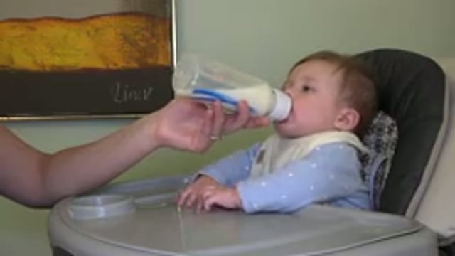 WESTMINSTER COLORADO-2015: Baby In A Blue Outfit With A White Bib Being