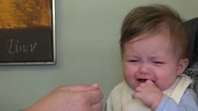 WESTMINSTER COLORADO-2015: A Person Attempting To Feed A Baby With A Spoon