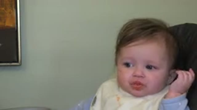 WESTMINSTER COLORADO-2015: Caregiver Trying To Feed Young Child Solid Orange Food